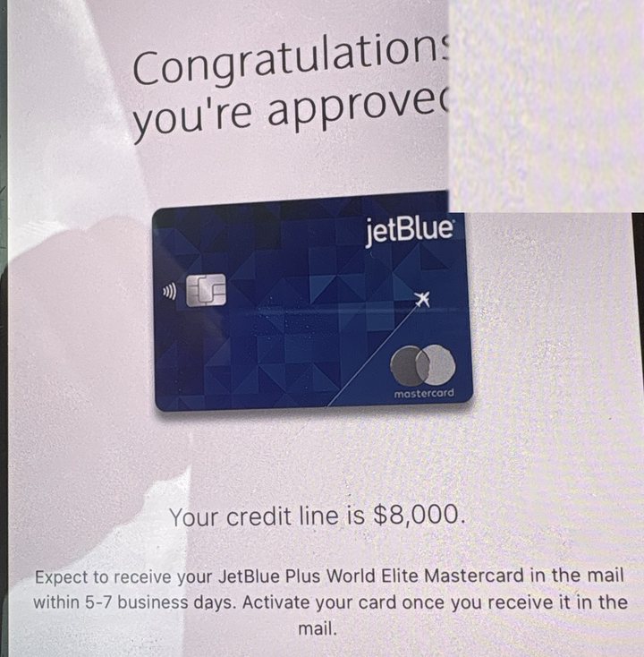 Card approval screen: credit line of $8,000